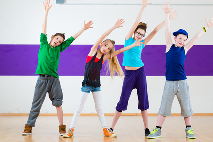 Kids train Zumba fitness in dancing school